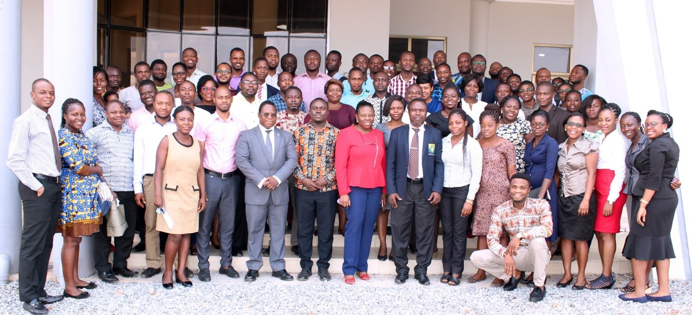 Participants with Trainers in a group photograph after the training workshop