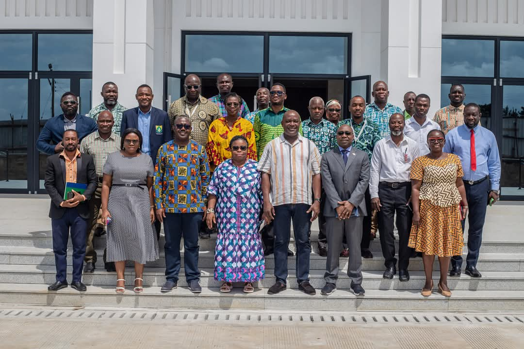 Faculty members standing together in group photo 